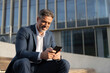 © Stock 4 You - Successful mature hispanic senior business man using smartphone cellphone financial application. Indian or latin confident middle age male entrepreneur businessman holding mobile cell phone outdoors