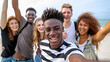 © Maciej Koba - Joyful Multiracial Teenagers Celebrating on the Beach - Youthful Energy, Friendship