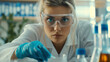 A female scientist wearing goggles and gloves is conducting research in a laboratory, with a focus on vision care and eye protection