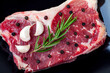 raw beef, black papper, gralic and rosemary for steak
