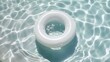inflatable ring in the swimming pool with water surface and sunlight. summer vacation concept.