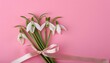 Whispering Spring: Small Bouquet of Snowdrops on Pink