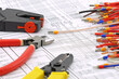 © Нелик Дулатов - Electrical installation tools for work on the assembly of electrical equipment. Close-up.