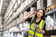 Female engineer is handling shipping and checking stock inventory in the warehouse with a tablet, industry, import-export, inventory management, logistics, global transportation at warehouse, business