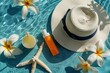 Sun hat, sunscreen, and tropical flowers on a sunny beach: essential summer vacation accessories