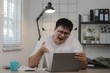 © PHOTO4U - an entrepreneur is being extremely stress with his employee about their mistake via video call, a businessman is sitting in his home office doing something about his work,