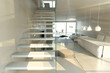 View from atop a modern floating staircase with glass steps, overlooking a minimalist living space.