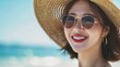© Denny - portrait of a vibrant Asian female tourist from Korea wearing sunglasses and a hat looking at the camera with a smile