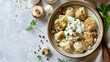 Bowl with tasty dumplings sour cream and mushrooms 