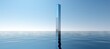 Tall pole in the middle of large body of water