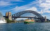 Fototapeta  - Sydney, New South Wales, Australia: View of Sydney Harbour Bridge and ferry boat