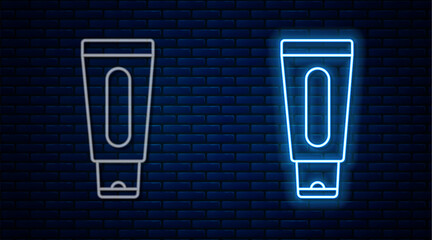 Sticker - Glowing neon line Tube of hand cream icon isolated on brick wall background. Vector