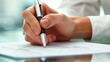 © bycengizbulut - A business executive closely examines important charts, pen in hand, ready to make strategic decisions.