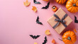 Composition with pumpkins gift box and paper bats