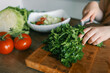 © shine.graphics - Child at table with leaf vegetables, a natural food ingredient