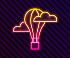 Wall Mural - Glowing neon line Hot air balloon icon isolated on black background. Air transport for travel. Vector