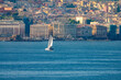 Sailing in the harbor of Naples, (Napoli), Campania, Italy. the historic city center can be see in the background