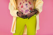belly with floral ornament, of pregnant girl close-up with hand in lace gloves bright clothes, spring vibe