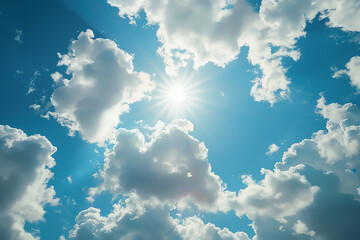 Wall Mural - Bright sunlight shining through fluffy clouds on a clear blue sky