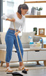 Sweeping, cleaning and woman with broom on floor at home for maintenance, dirt removal and hygiene. Female person, housework and thinking with equipment for dust, health and safety in living room