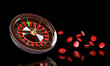 Spinning casino roulette wheel with flying chips