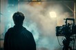 © StockUp - Film director on a moody lit set with powerful lights and smoke creating an immersive cinematic experience