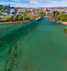 Wall Mural - Aerial view of Annecy and the lake, homes and green spaces, boats for navigation and pedestrian areas. Haute-Savoie. Pearl of the French Alps. France