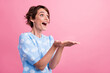 © deagreez - Profile portrait of astonished nice person open mouth look hands hold empty space proposition isolated on pink color background