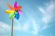Pinwheel windmill summer beach background concept for vacation copy or message