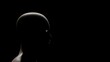 © Shubungsook - Illustration of a human head focusing on something in a contemplative mood on a black background.