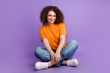 Wall Mural - Photo of positive adorable woman dressed fashionable outfit isolated on purple color background