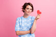 © deagreez - Photo of positive friendly lady hand hold small red paper heart symbol card isolated on pink color background