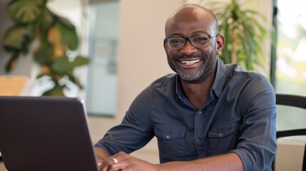 Wall Mural - Smiling Man with Laptop