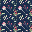 Christmas seamless pattern with holly, winter berries, candy canes and eucalyptus leaves. Elegant festive design on a dark blue background. Elements are painted with watercolors