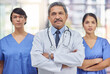 © peopleimages.com - Portrait, group and medical team in hospital, doctors and leadership. Stethoscope, healthcare and lab coat for collaboration, teamwork and professional with arms crossed or nurse, clinic and people