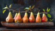 Artistically arranged pears on a rustic dark wood canoe.