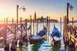 View of the gondolas of the Grand Canal bei sunrise in Venice, Italy. San Giorgio Maggiore.