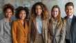 a group of cheerful people of different nationalities in business style clothes on a grey background 