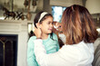 © peopleimages.com - Girl, crying and mother wipe tears for bullying, frustrated and failing grades in house with school difficulties. Daughter, sad and mom with tissue for family conflict, angry and puberty in home