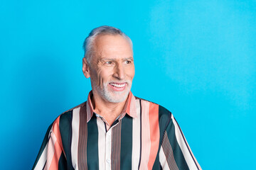 Poster - Photo of handsome nice senior man wear striped trendy clothes look empty space isolated on blue color background