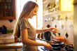 © peopleimages.com - Crack, egg and happy woman in kitchen cooking for food, wellness or nutrition for healthy dish. Pan, breakfast or girl with smile in home for lunch meal prep, vegan diet or protein vitamins in France