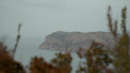 Wall Mural - Slow motion, panoramic view to the cliffs and the Mediterranean sea in the sunny morning.