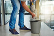 © peopleimages.com - Janitor, mop or cleaning floor in office for housekeeping, building maintenance and hygiene services. Bucket, hospitality professional or caretaker in workplace for health, maintenance or bacteria