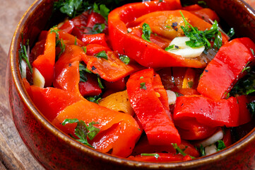 Wall Mural - Grilled red peppers, sweet paprika salade with fresh garlic and parsley