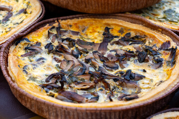 Wall Mural - Tasty vegetarian food, french quiche savoury tart with leek onion and cheddar cheese and mushrooms