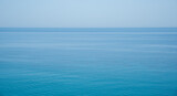 Fototapeta Do pokoju - Still calm sea or ocean blue water surface background