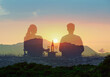 © kieferpix - A romantic couple on a picnic sits in a together at sunset. Romantic getaway, summer holiday travel concept