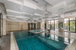 © alhim - Luxury indoor private pool with waterfall jet, Jacuzzi and ladder. Panoramic windows.