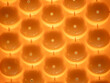 Abstract background of shiny orange plastic bubbles.