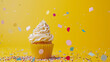 Birthday cupcake with confetti on yellow background. Close up cute cupcake